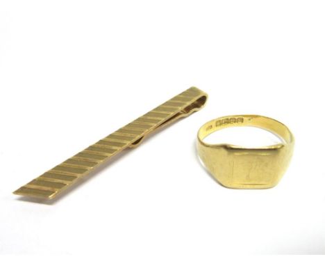 AN 18CT GOLD SIGNET RING Birmingham 1934, finger size U, 5g gross; with a 9ct gold tie slide, 4g gross