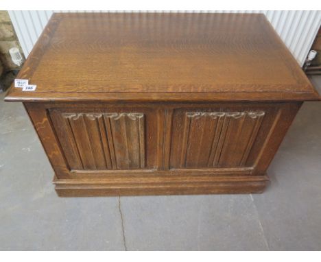 An oak linen fold two panel blanket box - Height 51 cm x Width 82 cm x Depth 51 cm 