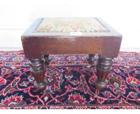 A 19th century mahogany foot stool on reeded Gillows type legs - 28cm x 23cm x 24cm tall