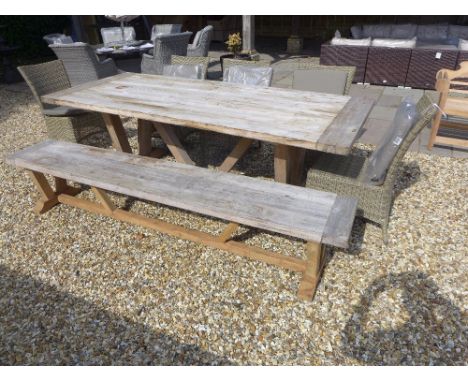 A Bramblecrest Kuta table with one Kuta bench and four Sahara sidechairs