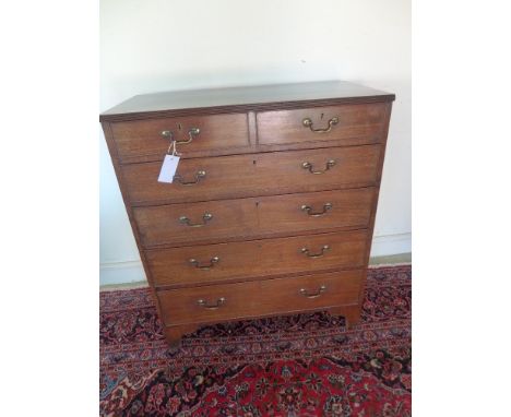 A Georgian mahogany six drawer chest of drawers with two short over four long drawers standing on bracket feet - Height 1.08 