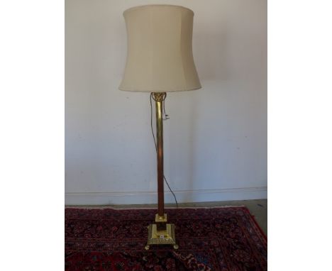 A tall Corinthian column brass standard lamp on stepped base with four lions paw feet and thick reeded column - Height withou