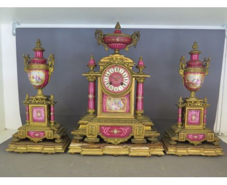 A Serves style ormolu and porcelain three piece clock garniture mid 19th century by Japy Freres, the clock surmounted by a je