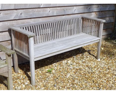 A wooden garden bench of ribbed back and sides  - 156cm x 57cm x 75cm