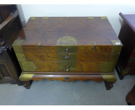 An Oriental hardwood brass bound trunk hinged lift top lid over drawer above shaped bracket supports joined by stretchers - 8