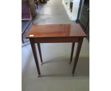A 20th century mahogany hall table of rectangular form with squared tapered legs and cup castors top - 28cm x 53cm, height 66