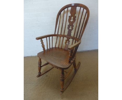 A 19th century ash and elm stick back rocking chair