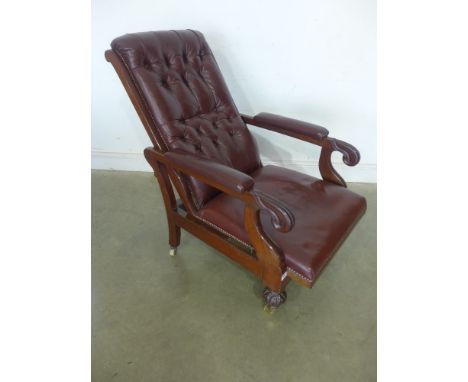A 19th century mahogany reclining button back leather library scroll armchair