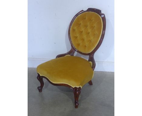 A 19th century mahogany framed button back nursing chair