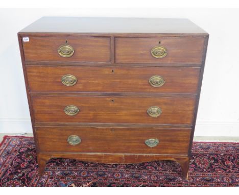 A good quality late Georgian mahogany caddy top chest of drawers with two short drawers over three long drawers with oval pla