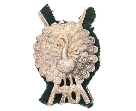 Badge. Indian Army 70th Burma Rifles WWI cap badge circa 1917-22.  Good scarce die-cast silvered Peacock in full display supe