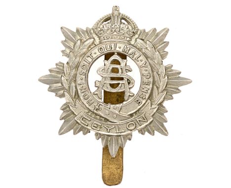 Badge. Ceylon Army Service Corps cap badge by Gaunt.  Good scarce British made die-stamped white metal example.  J.R. Gaunt  
