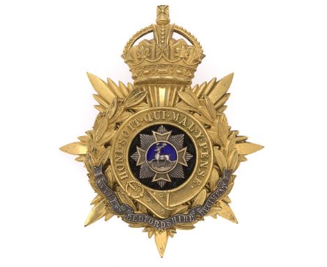 Badge. Bedfordshire Regiment Officer's helmet plate circa 1901-14.  Fine gilt crowned star mounted with Garter and laurel spr