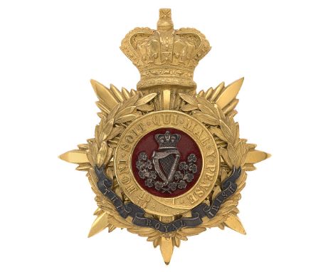 Badge. Royal Irish Regiment Victorian Officer's helmet plate circa 1881-1901.  Fine gilt crowned star mounted with Garter and