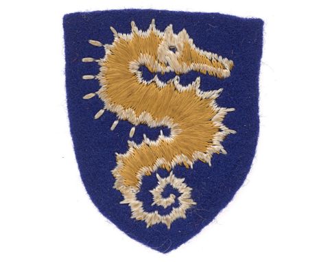 Badge. 27th Armoured Brigade embroidered cloth formation sign.    Good scarce white edged golden seahorse on blue felt shield
