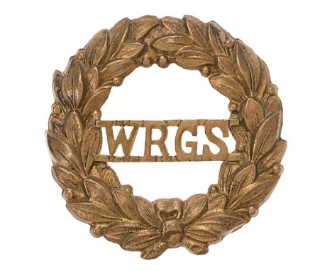 Badge. Worcester Royal Grammar School OTC cap badge.  Good scarce die-stamped brass wreath with WRGS to voided centre. (KK 26