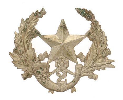 Badge. Scottish. 2nd (Hamilton) VB Cameronians glengarry badge circa 1887-1908.  Good scarce die-stamped white metal Mullet o