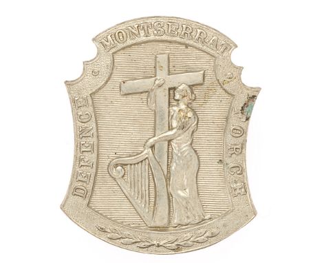 Badge. West Indies. Montserrat Defence Force post 1945 cap badge.  Good scarce British made die-stamped issue. Central figure