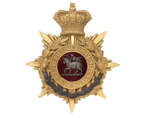 Badge. Royal West Surrey Regiment Victorian Officer's helmet plate circa 1881-1901.  Fine gilt crowned star mounted with Gart