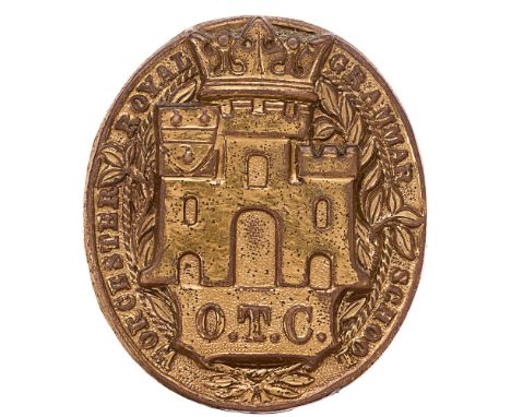 Badge. Worcester Royal Grammar School OTC cap badge.  Good scarce die-stamped brass title oval, castle to solid centre. (KK 2