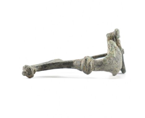 Antiquities - A 3rd / 4th Century roman fibula crossbow / trumpet brooch having a straight pin and spring coil. Measures appr