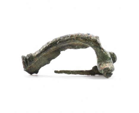 Antiquities - A roman fibula crossbow brooch having a straight hinged pin with some remnants of enamel. Measures approx 4cm w