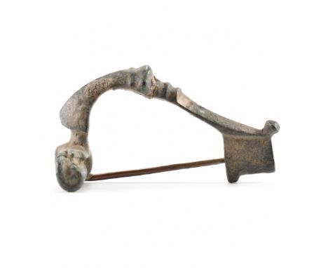 Antiquities - A 3rd / 4th Century roman fibula crossbow / trumpet brooch having a straight pin and spring coil. Measures appr