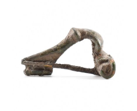 Antiquities - A roman fibula crossbow / trumpet brooch having a straight pin and spring coil. Measures approx 3.7cm wide.&nbs