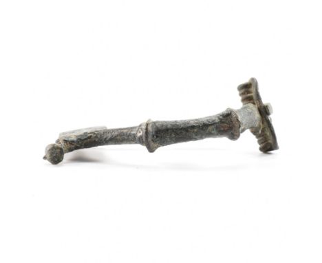 Antiquities - A 3rd / 4th Century roman fibula crossbow / trumpet brooch having a straight pin and spring coil. Measures appr