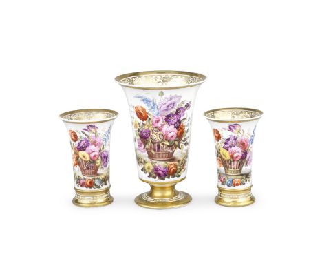 A garniture of three Spode vases, circa 1815-20Of trumpet shape, painted with baskets of flowers, the reverse with further sp