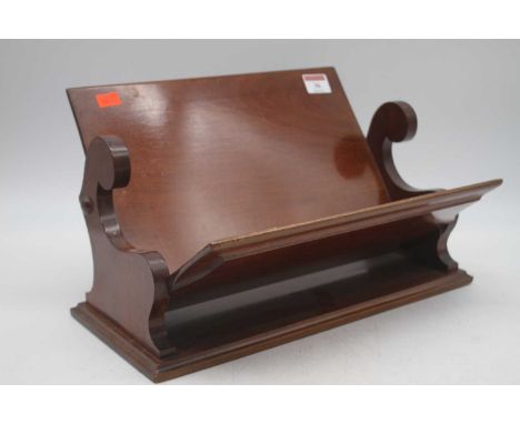 An Edwardian mahogany book trough, width 34cm