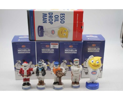 A set of four Wade limited edition Michelin figures, each boxed; together with a Royal Doulton Millennium Collectibles ESSO o