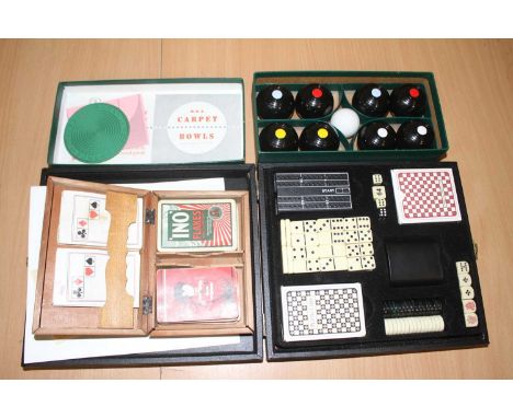 A cased set of miniature indoor carpet bowls; together with a treen box containing playing cards and a Marks &amp; Spencer's 