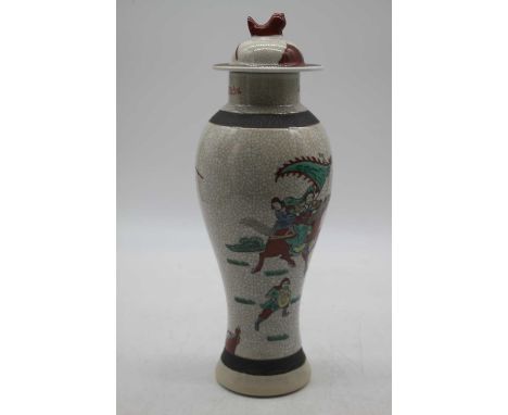 A modern Chinese vase and cover of baluster form decorated with figures on horseback, height 32cm