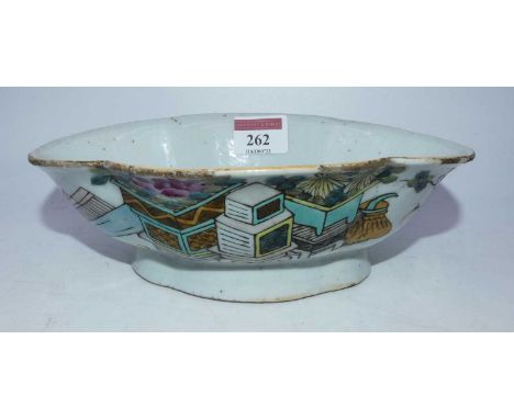 A 19th century Chinese export stoneware bowl of shaped oval form, enamel decorated with a planter issuing flowers with Chines