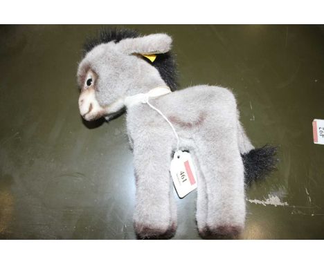 A Steiff donkey, with yellow label numbered 3605/20, h.20cmIn good condition, no apparent losses.