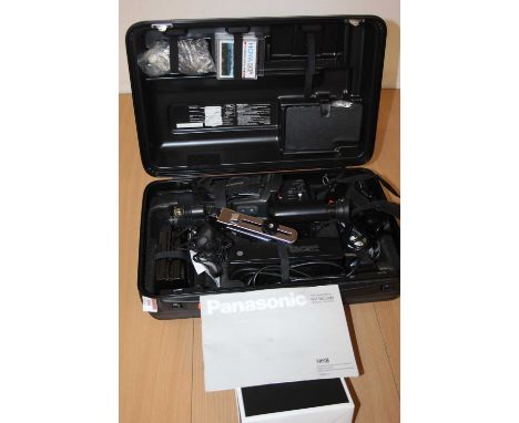 A Panasonic VHS-C movie video camera and accessories, in fitted case 