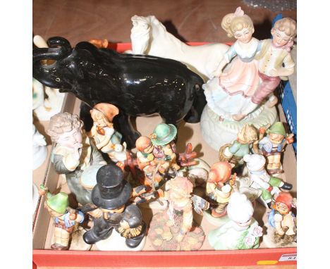 A collection of assorted figures to include Hummel etc