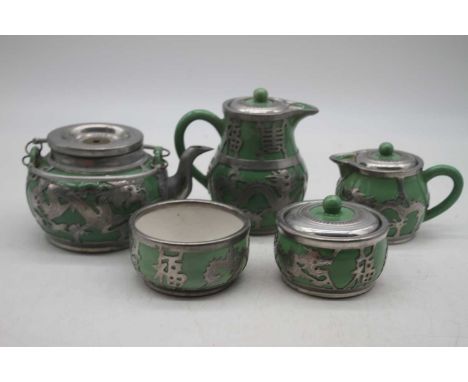 A Chinese soft paste porcelain and metal mounted five-piece tea set