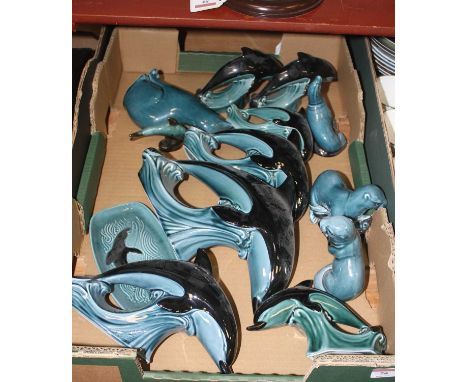 A collection of Poole Pottery figures to include dolphins, otter, etc