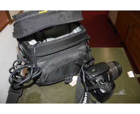A Canon 400D digital camera in bag 