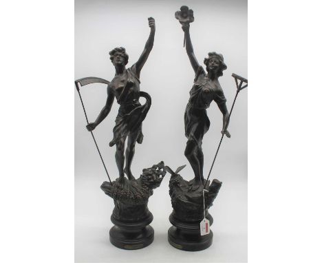A pair of early 20th century spelter figures, each on wooden socle base entitled Le Faucheur and La Faucheuse, height 66cm