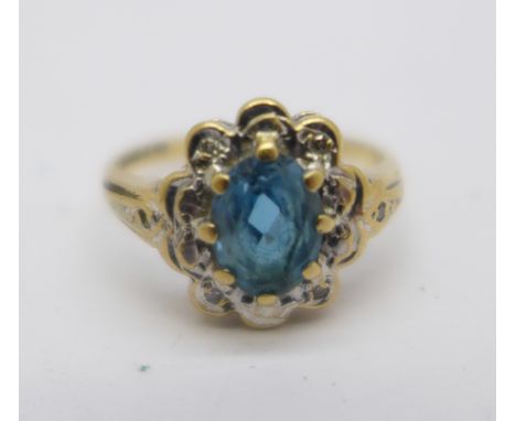 A 9ct gold, blue stone and diamond ring, 1.9g, I