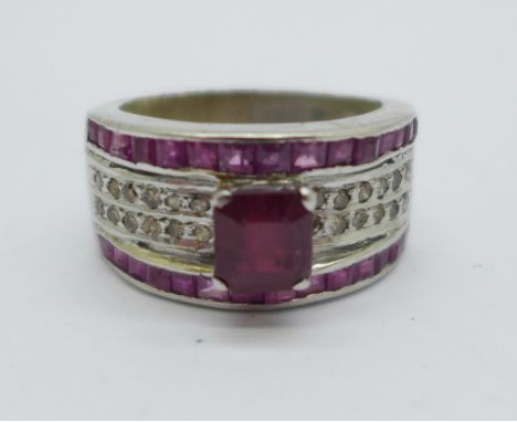 A large ruby and diamond set ring, V, inner shank a/f