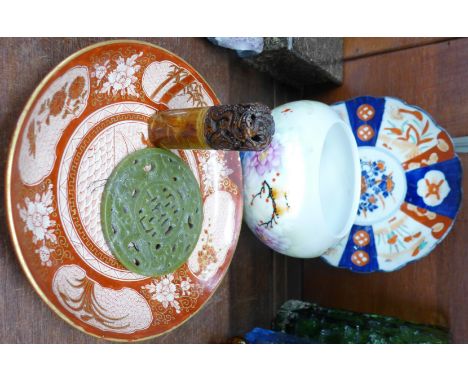 Two oriental plates and a bowl, a carved jade disc and a carved stone seal