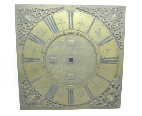 A brass longcase clock dial