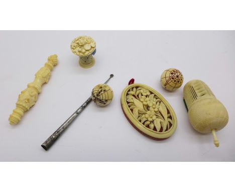 Needlework items including two tape measures and a carved ivory pin cushion