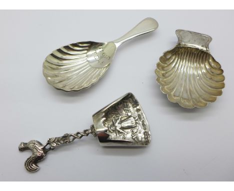 A George III silver caddy spoon, Sheffield 1785, Daniel Holy &amp; Co., repaired, one other silver caddy spoon and a Lyons Te