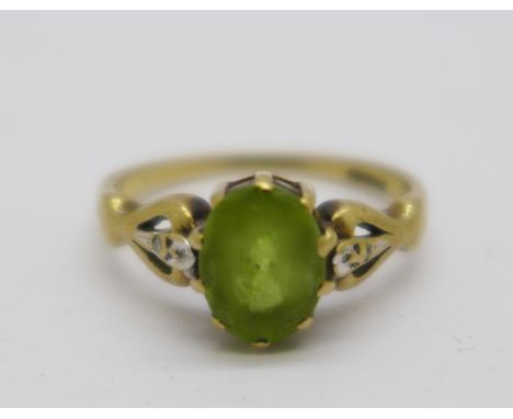 A 9ct gold and green stone ring, 2.3g, P