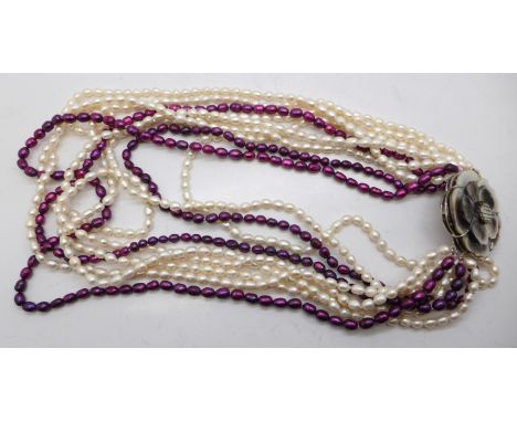 A large pearl necklace with abalone clasp
